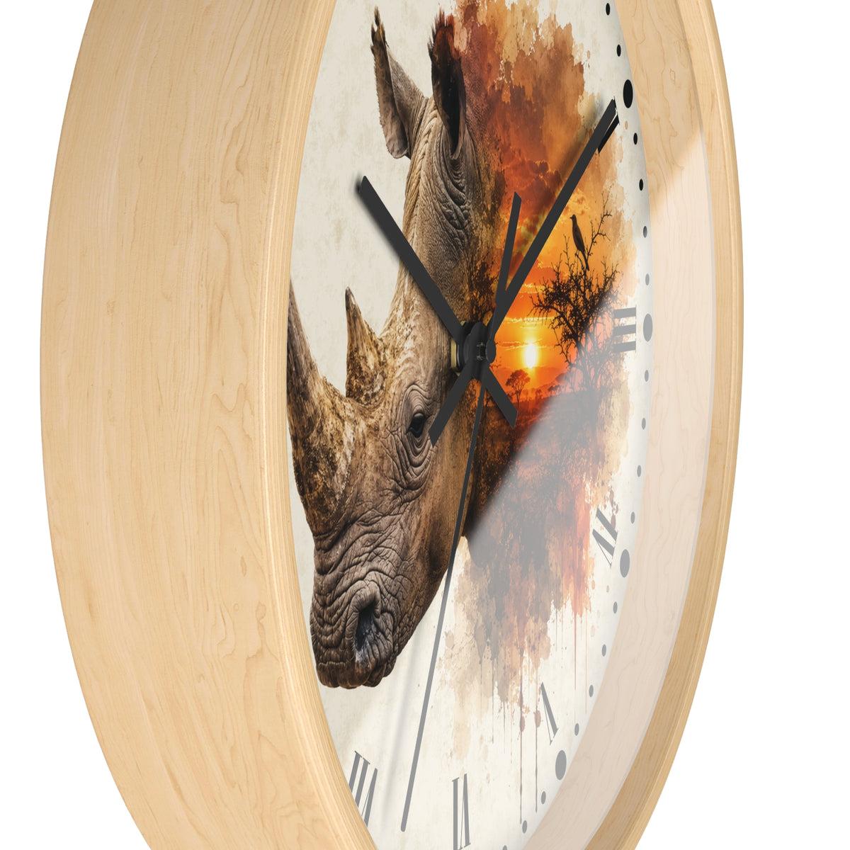 A round wall clock with a light natural wood frame and a printed face featuring a rhinoceros head over an orange sunset scene, shown on a plain white background.