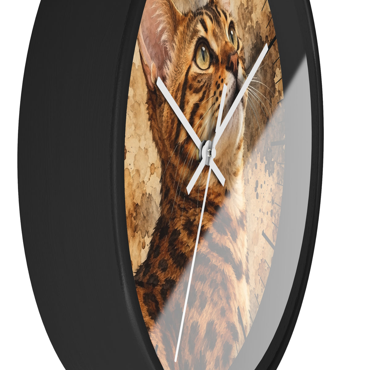 Round wall clock with a black frame and a printed cat face and fur design on the face, with white hands, shown against a plain white background.