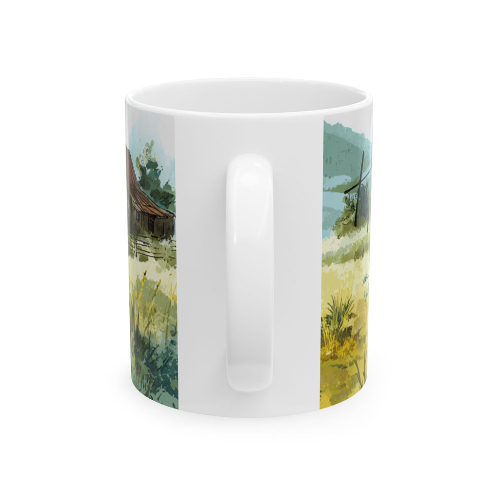 White mug with a scenic design of a lake and trees on a white background