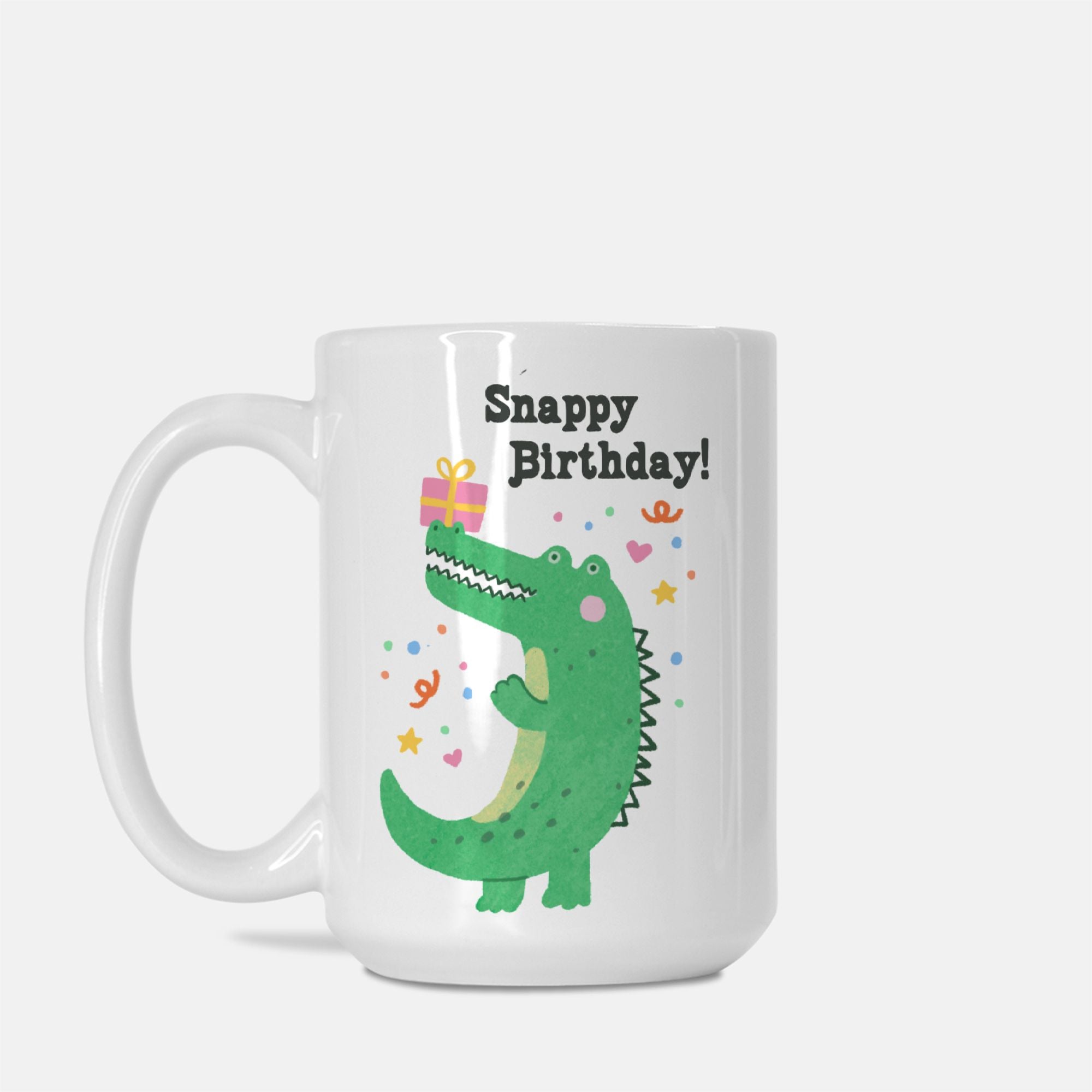 White mug with a green alligator design and 'Snappy Birthday!' text on a white background