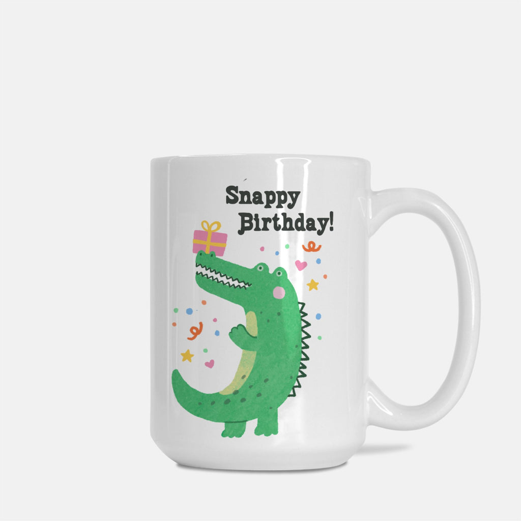 White mug with a green alligator design and 'Snappy Birthday!' text on a white background