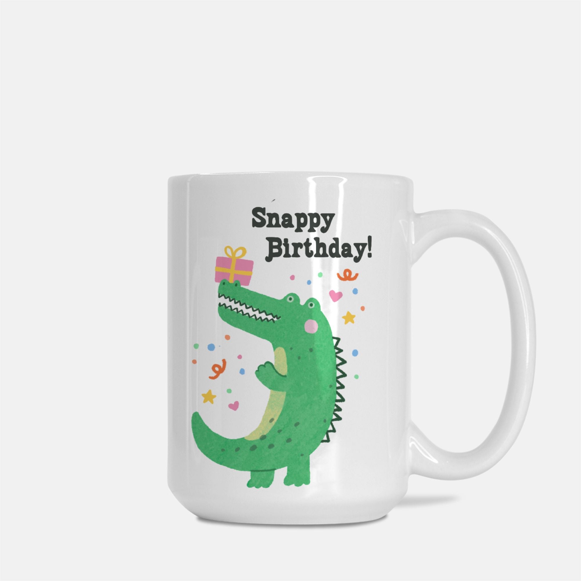 White mug with a green alligator design and 'Snappy Birthday!' text on a white background