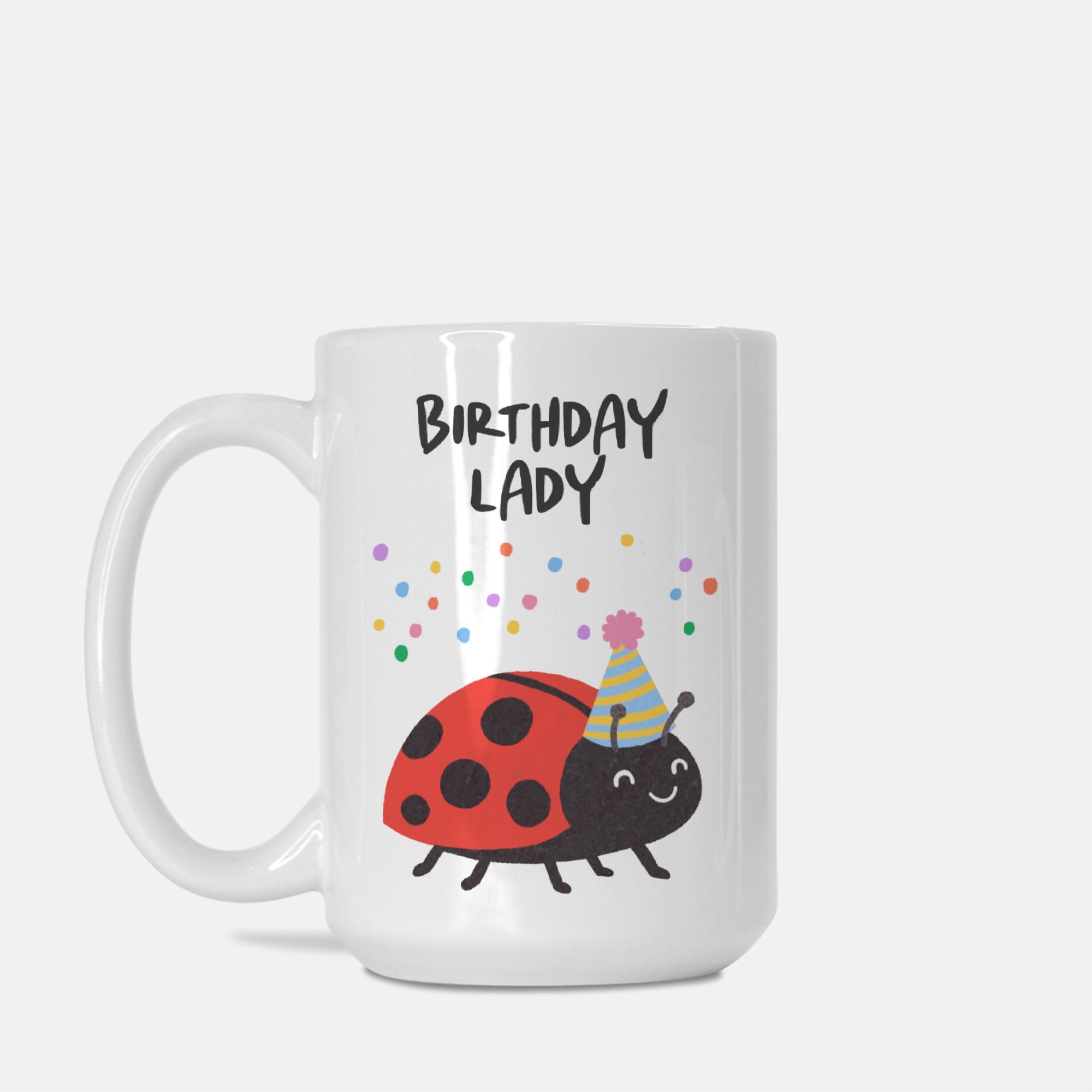 White mug with a ladybug design and 'Birthday Lady' text on a white background