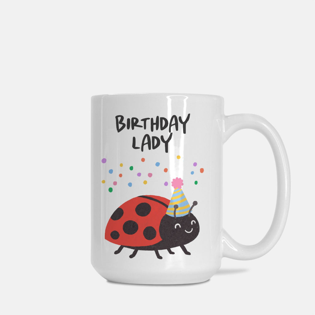 White mug with a ladybug design and 'Birthday Lady' text on a white background