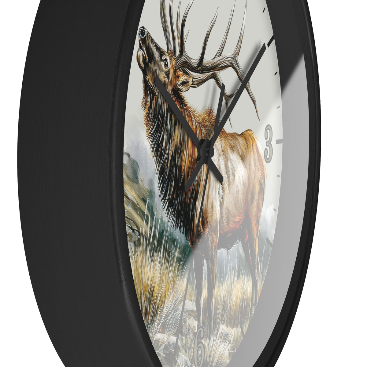 A close-up of a round wall clock with a black frame and a printed design of a large brown elk standing in grass on the face. The clock has black hands and a white background with partial black numerals visible.