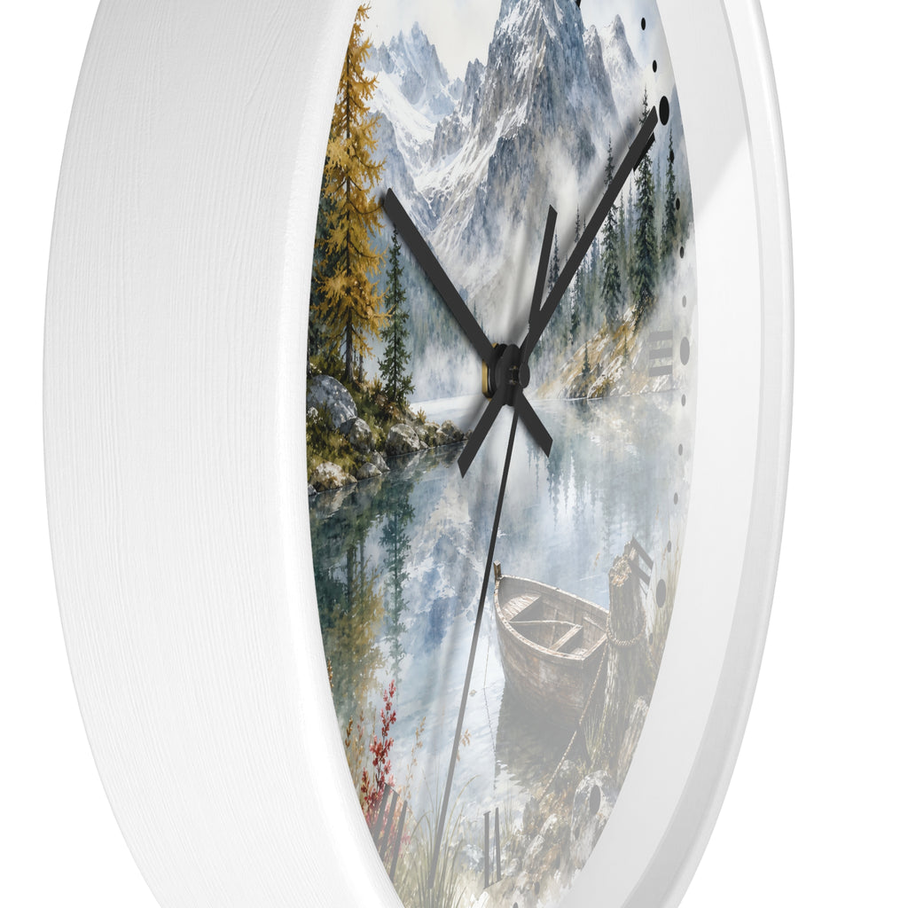 Round wall clock with a white frame and a scenic printed dial showing a mountain lake landscape with trees, a boat, and black clock hands.