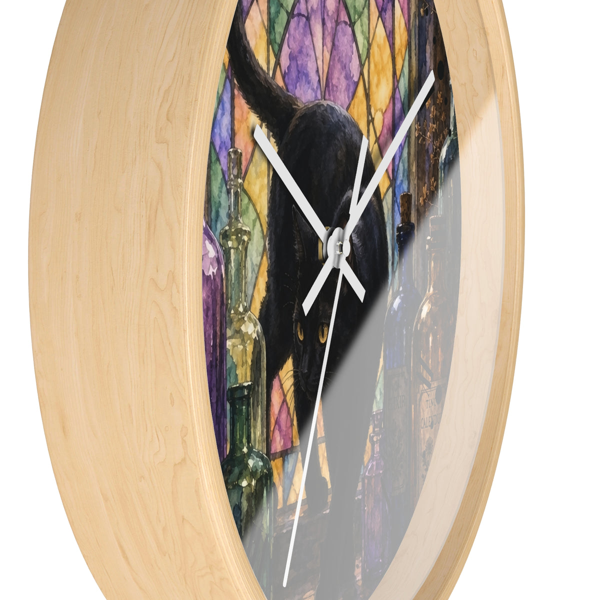 Round wall clock with a light natural wood frame and a printed face showing a black cat in front of a colorful stained-glass-style background with wine bottles.