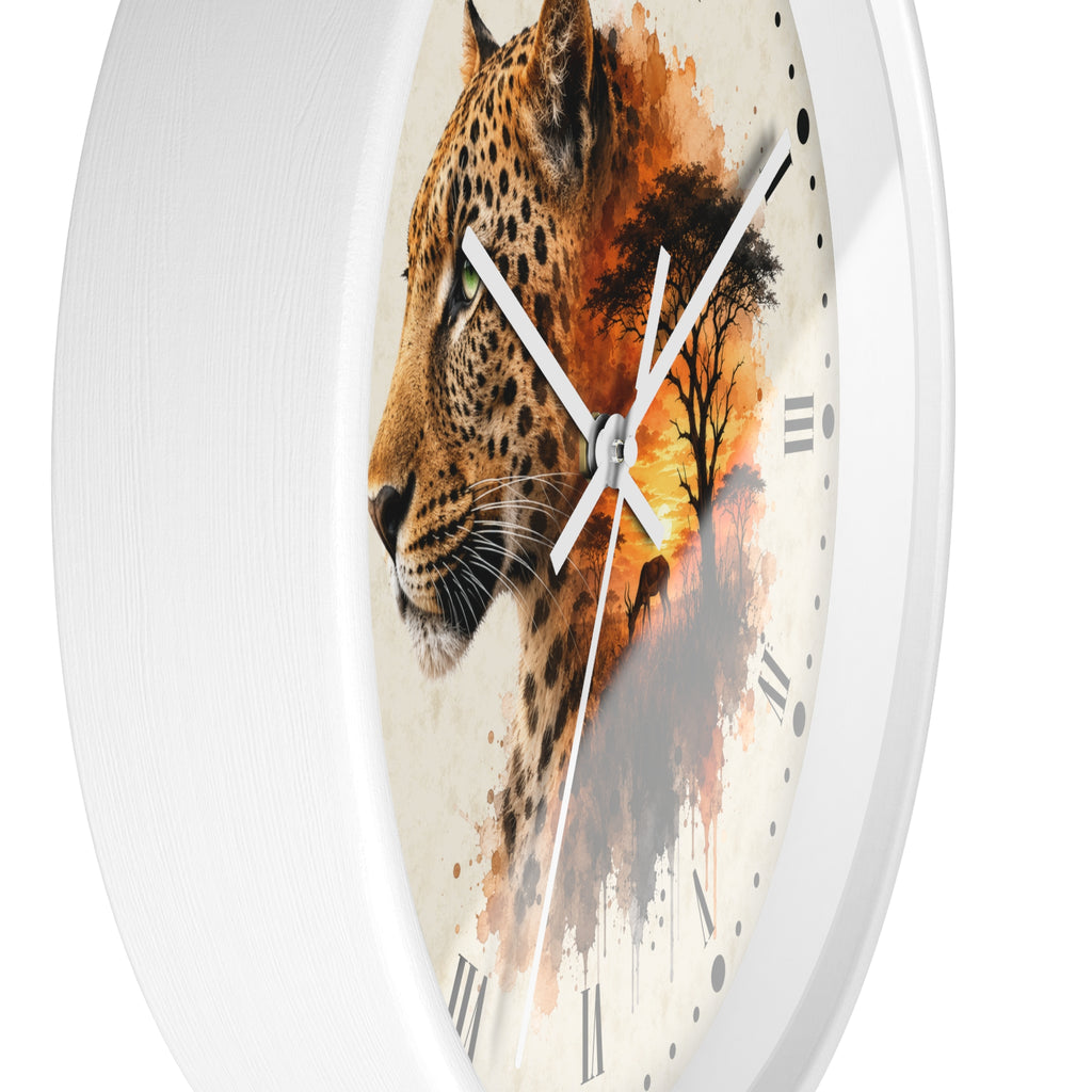 A round wall clock with a white frame and a printed face featuring a leopard profile blending into an orange-toned sunset landscape, with white Roman numerals and silver hands.