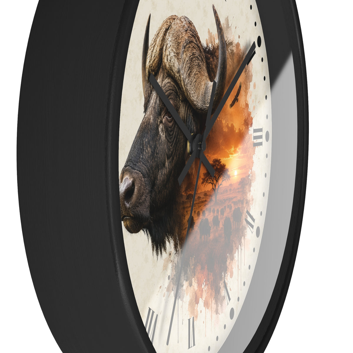 A round wall clock with a black frame and a white face featuring a detailed side profile of a buffalo overlaid with an orange sunset landscape print.