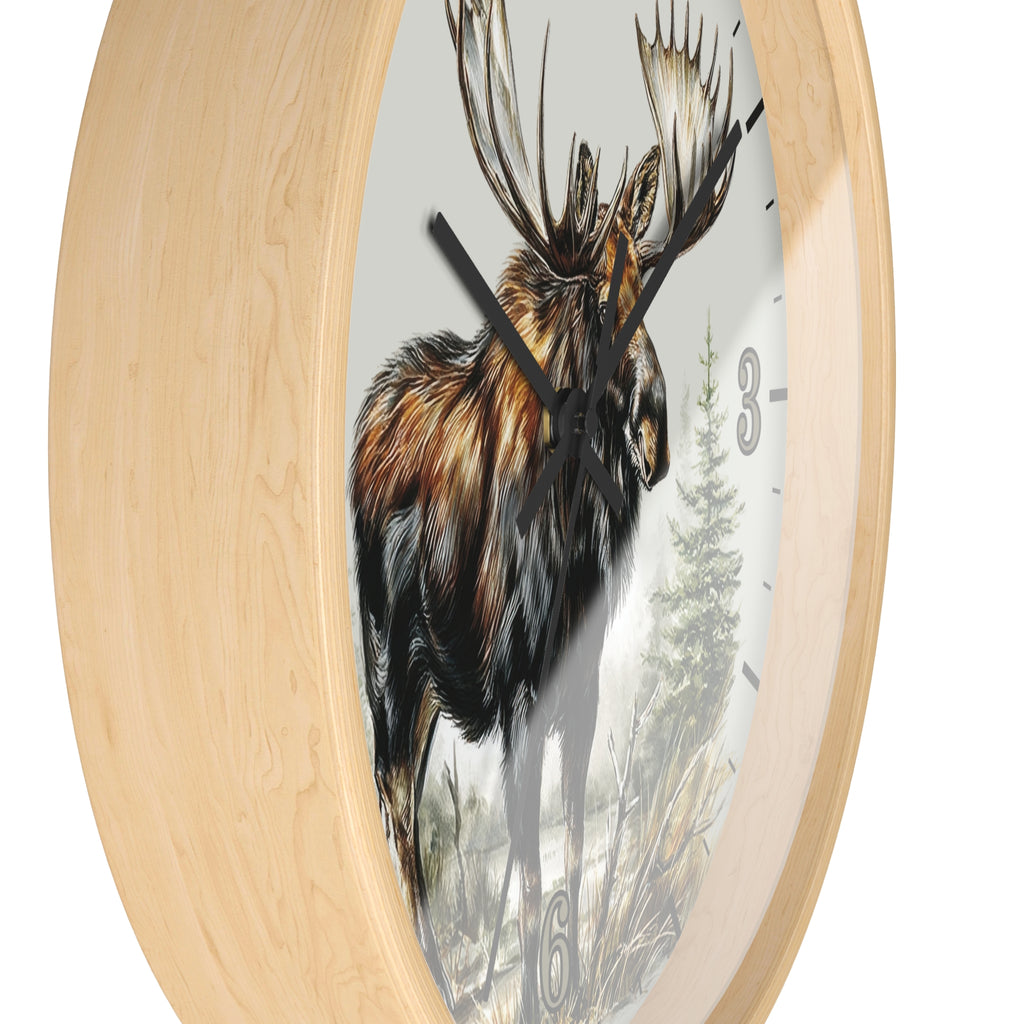 Round wall clock with a light natural wood frame and a printed moose illustration on the face, shown against a plain white background.