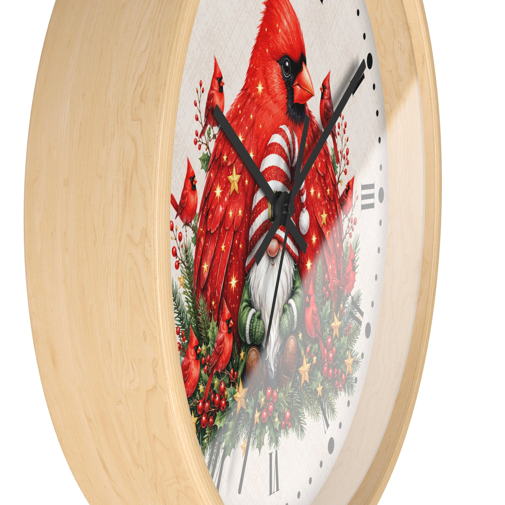 Round wall clock with a light natural wood frame and a festive printed face featuring bright red cardinals, evergreen branches, red berries, and holiday ornaments on a white background.