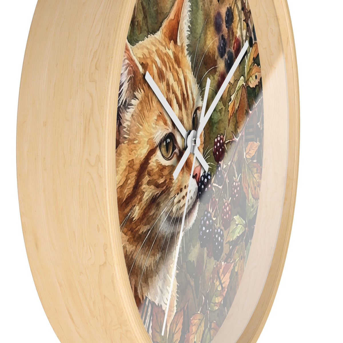 Round wall clock with a light natural wood frame and a printed illustration of an orange tabby cat over a background of leaves and blackberries, with white clock hands.