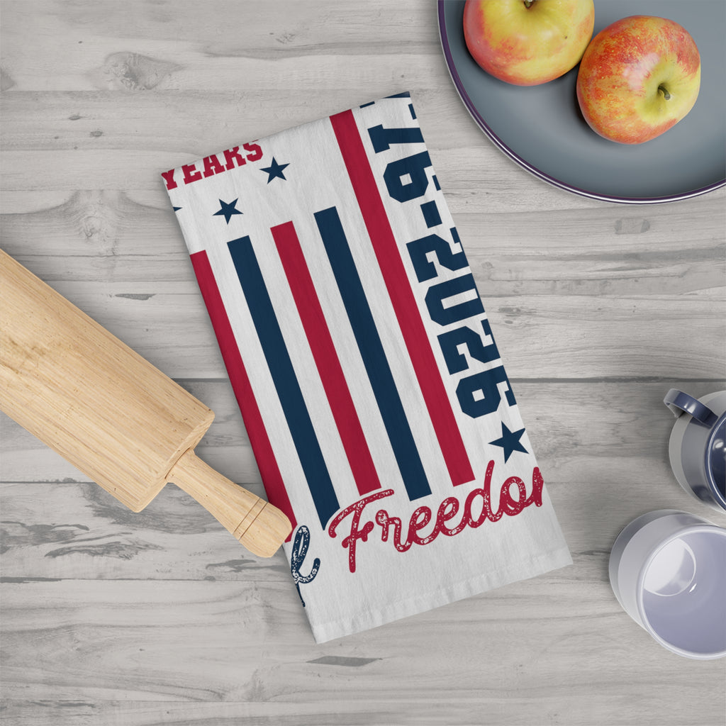 Tea towel with American flag design and 'Freedoms' text on a kitchen counter.