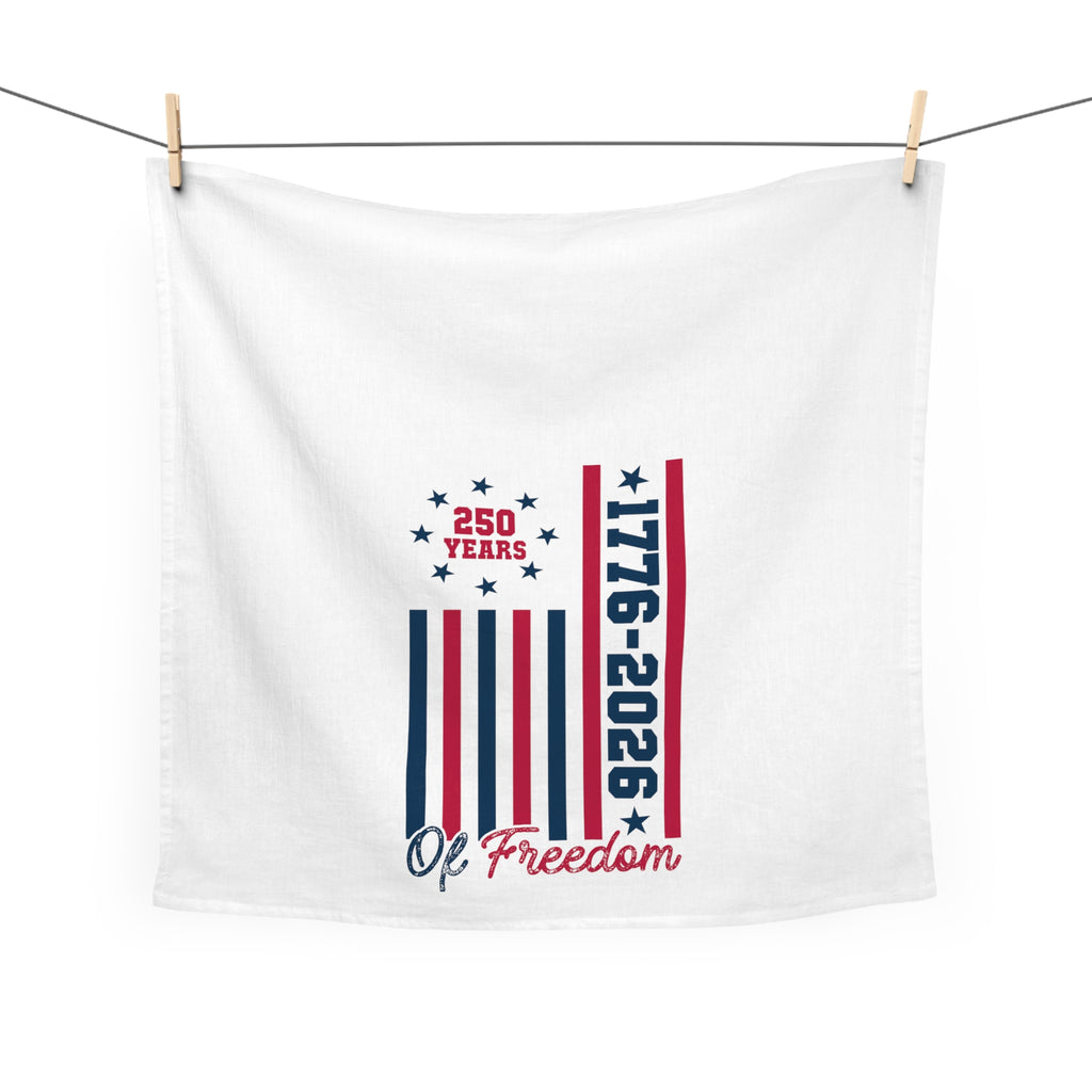 White tea towel with '250 Years 1776-2026 Of Freedom' design hanging on a white background