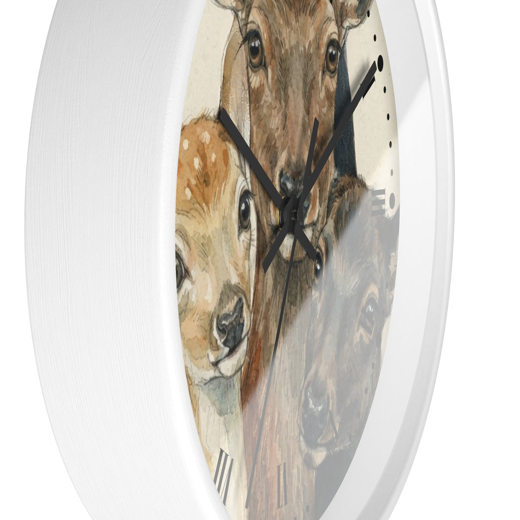 A round white wall clock with a detailed animal illustration on the face, featuring a deer, a fawn, and a bear. The clock has black hands and is shown against a plain white background.