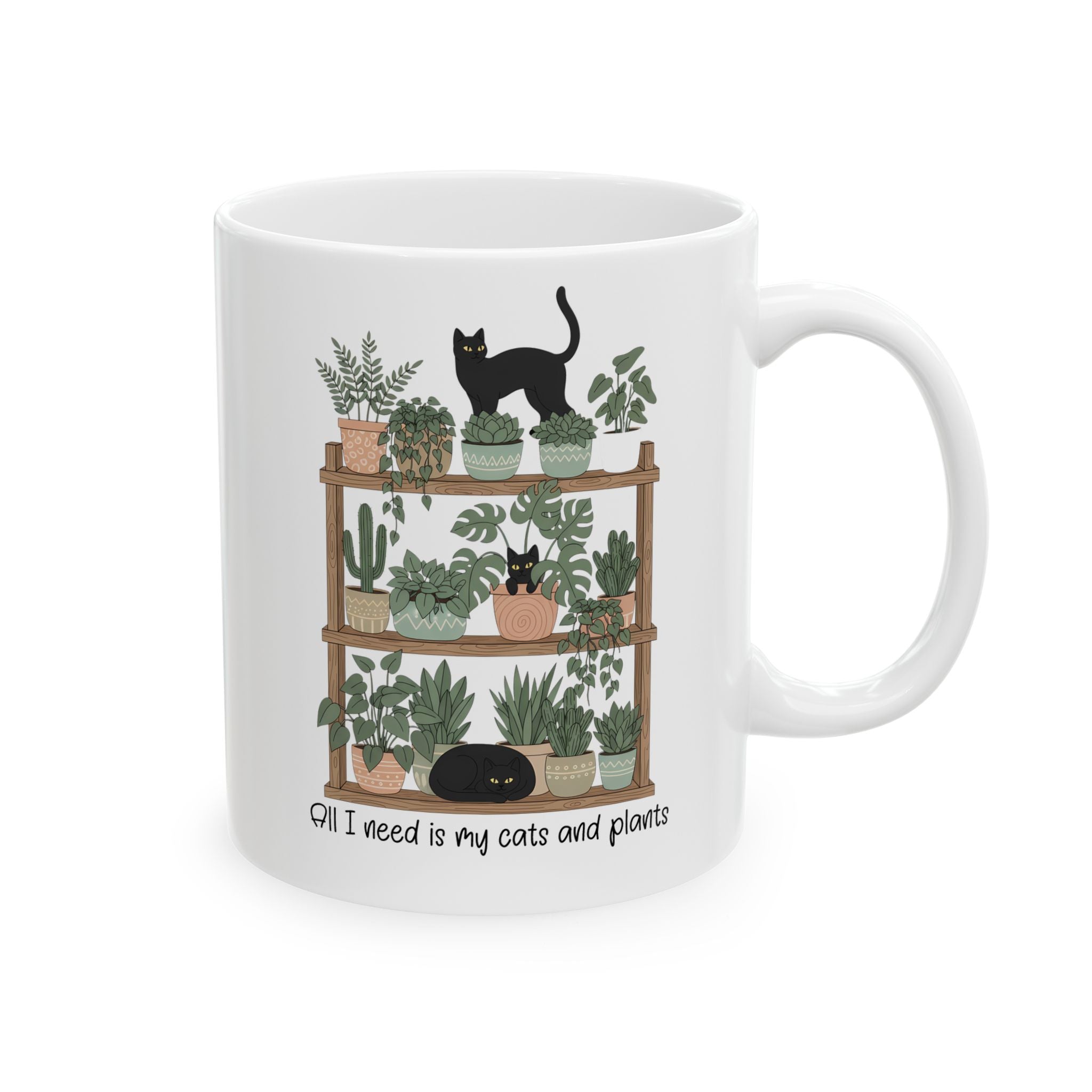 White mug with a design of cats and plants on a white background
