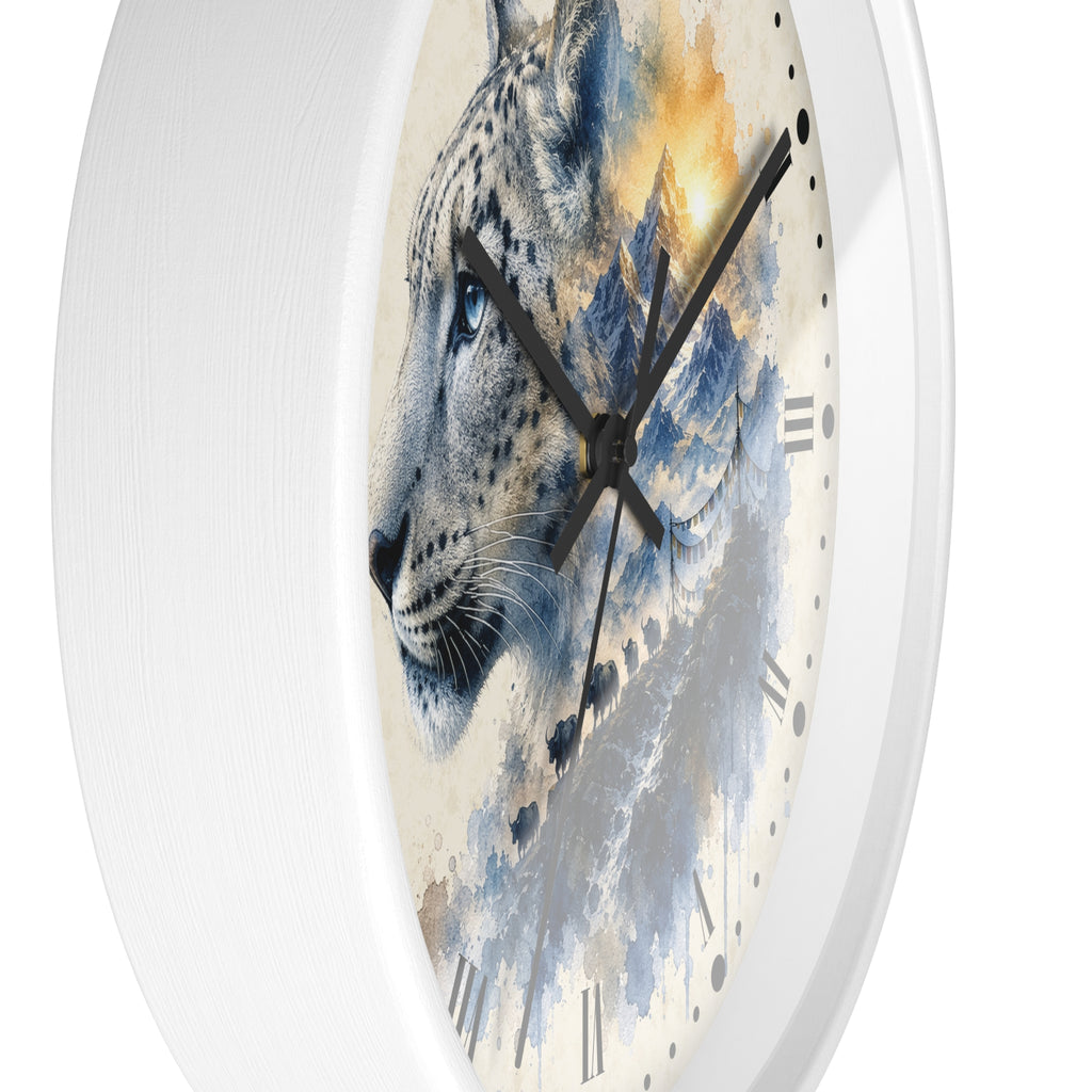 A round wall clock with a white frame and a printed face featuring a stylized snow leopard in blue, gray, cream, and warm golden tones over a mountain-like watercolor background.
