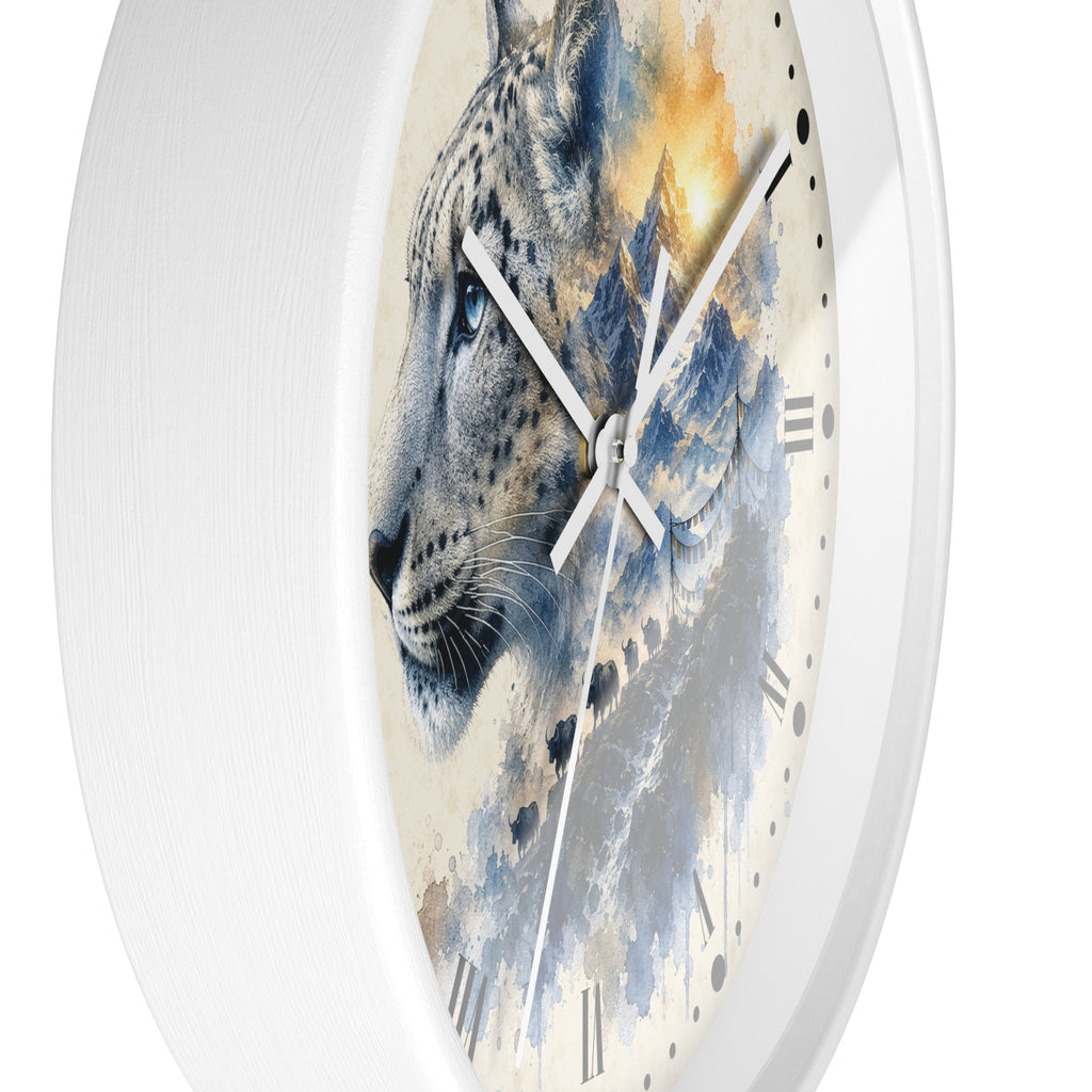 A round wall clock with a white frame and a printed face featuring a stylized snow leopard in blue, gray, cream, and warm golden tones over a watercolor mountain background.