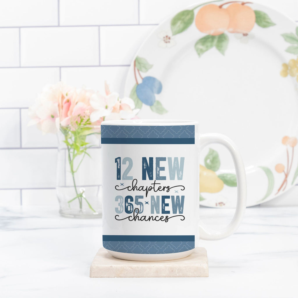 Mug with motivational quote on a kitchen counter with a decorative plate and flowers.