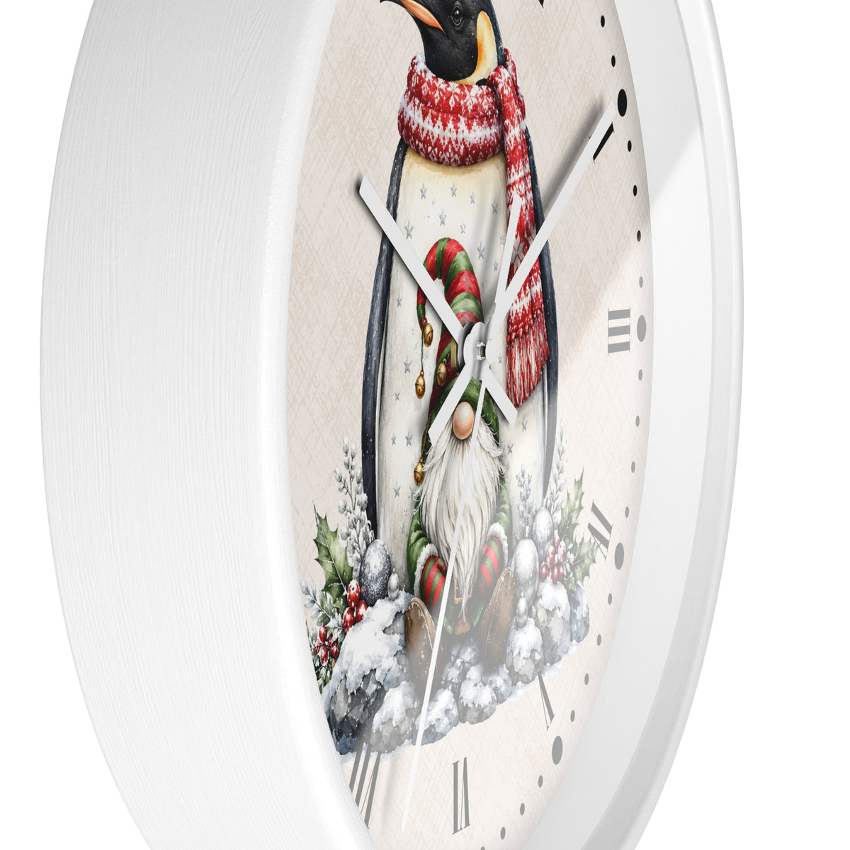 A white round wall clock with a festive penguin illustration on the face. The penguin is wearing a red and white striped knit scarf and a green-and-red striped hat, standing in a snowy winter scene with holly and berries.