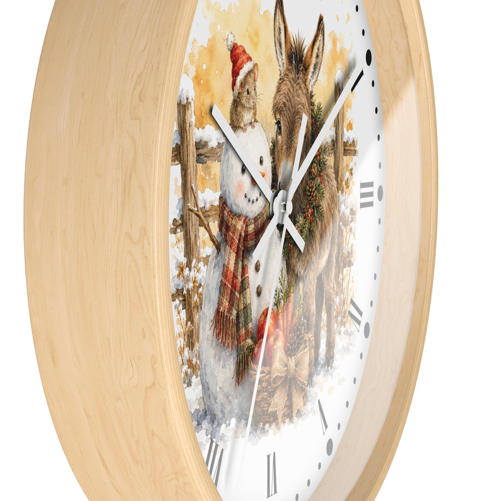 Round wall clock with a light natural wood frame and a white dial featuring a winter illustration of a rabbit in a Santa hat and a donkey wearing a wreath.