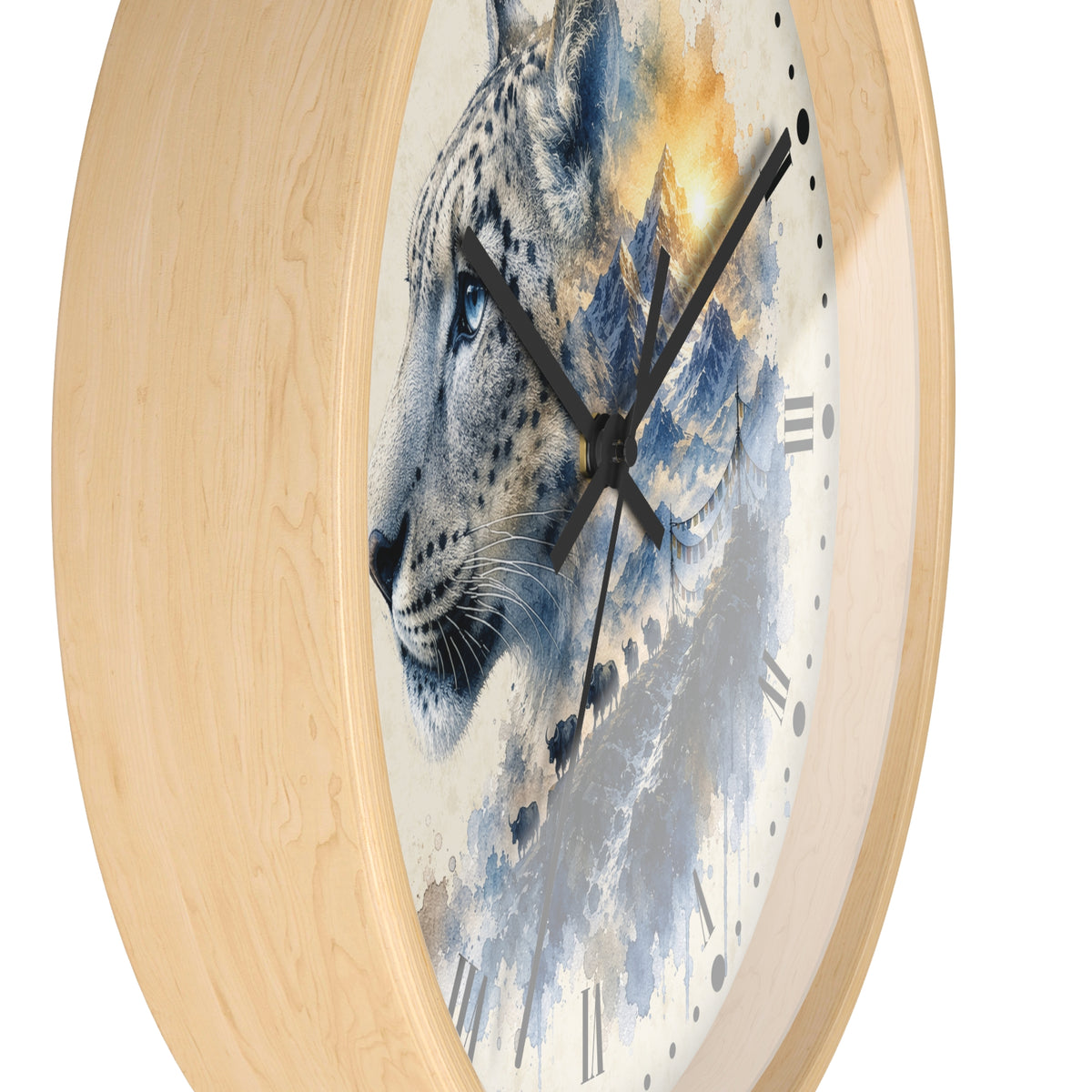 A round wall clock with a light natural wood frame and a printed face featuring a stylized blue-gray leopard or snow leopard in profile against a watercolor mountain background with warm golden highlights.