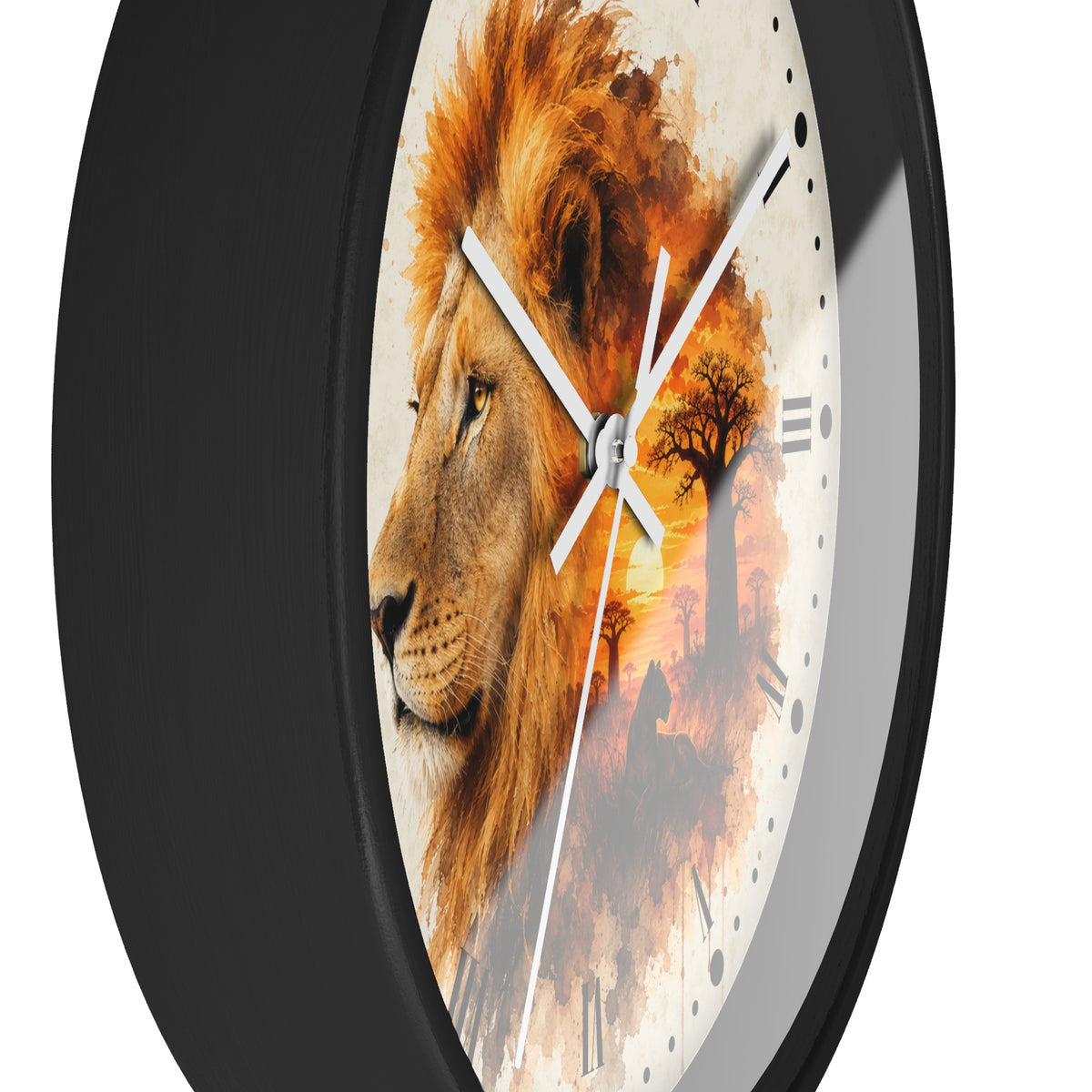 A round wall clock with a black frame and a printed safari design featuring a lion face on the left and an orange-toned savanna scene with a tree on the right. White clock hands and small black hour markers are visible against a plain light background.