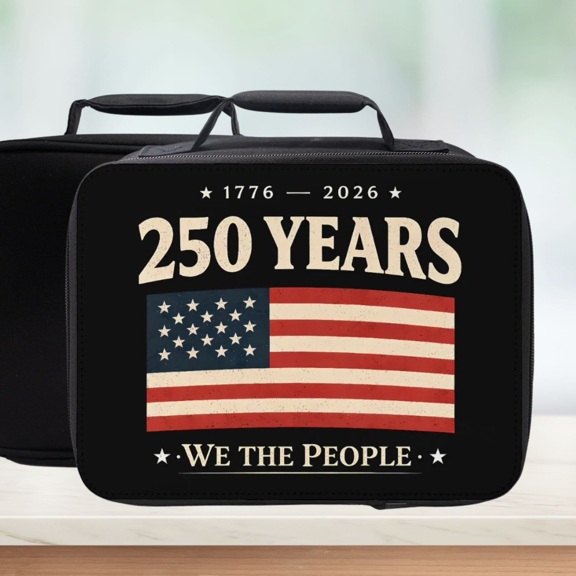 Black bag with American flag and '250 Years 1776-2026 We the People' text on a blurred background