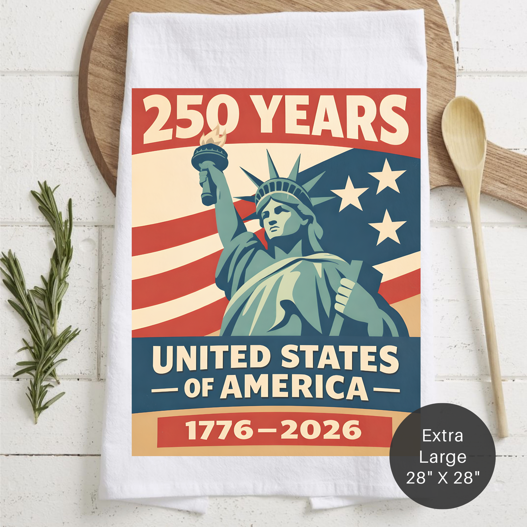 Tea towel with Statue of Liberty design celebrating 250 years of United States of America, placed on a wooden board.