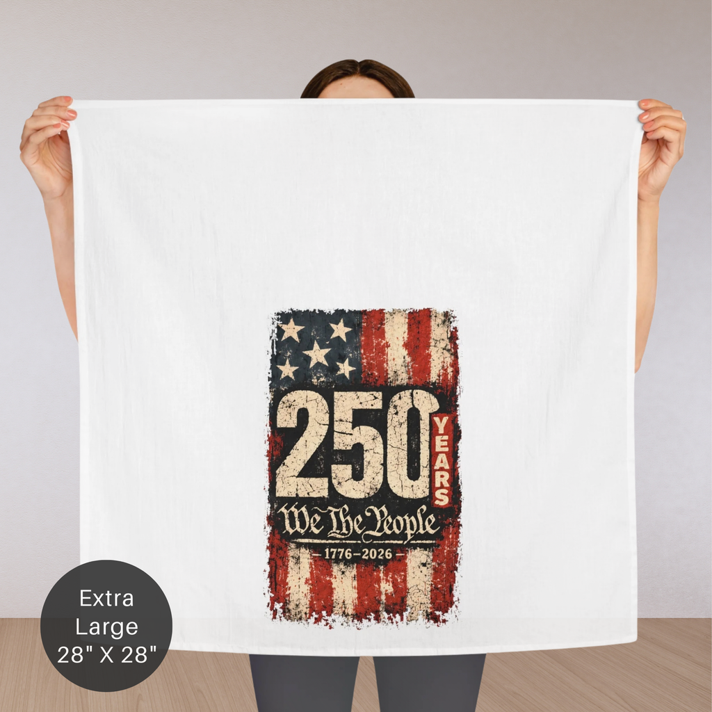 Person holding an extra large tea towel with '250 Years We The People 1776-2026' text and American flag design.