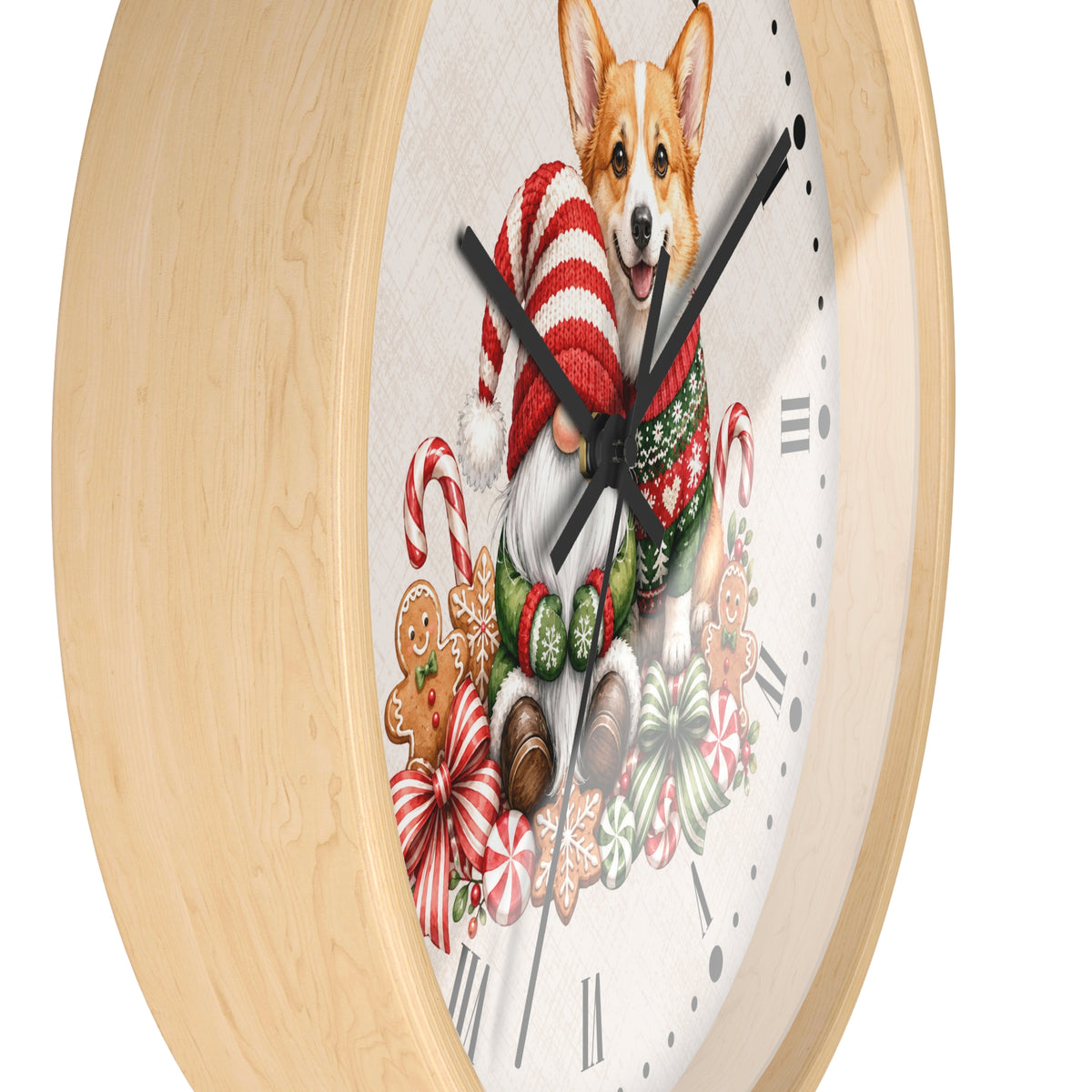 A round wall clock with a light natural wood frame and a white clock face featuring a festive Christmas illustration of a corgi wearing a red-and-white striped knit hat and green scarf, surrounded by candy canes, gingerbread cookies, and bows.