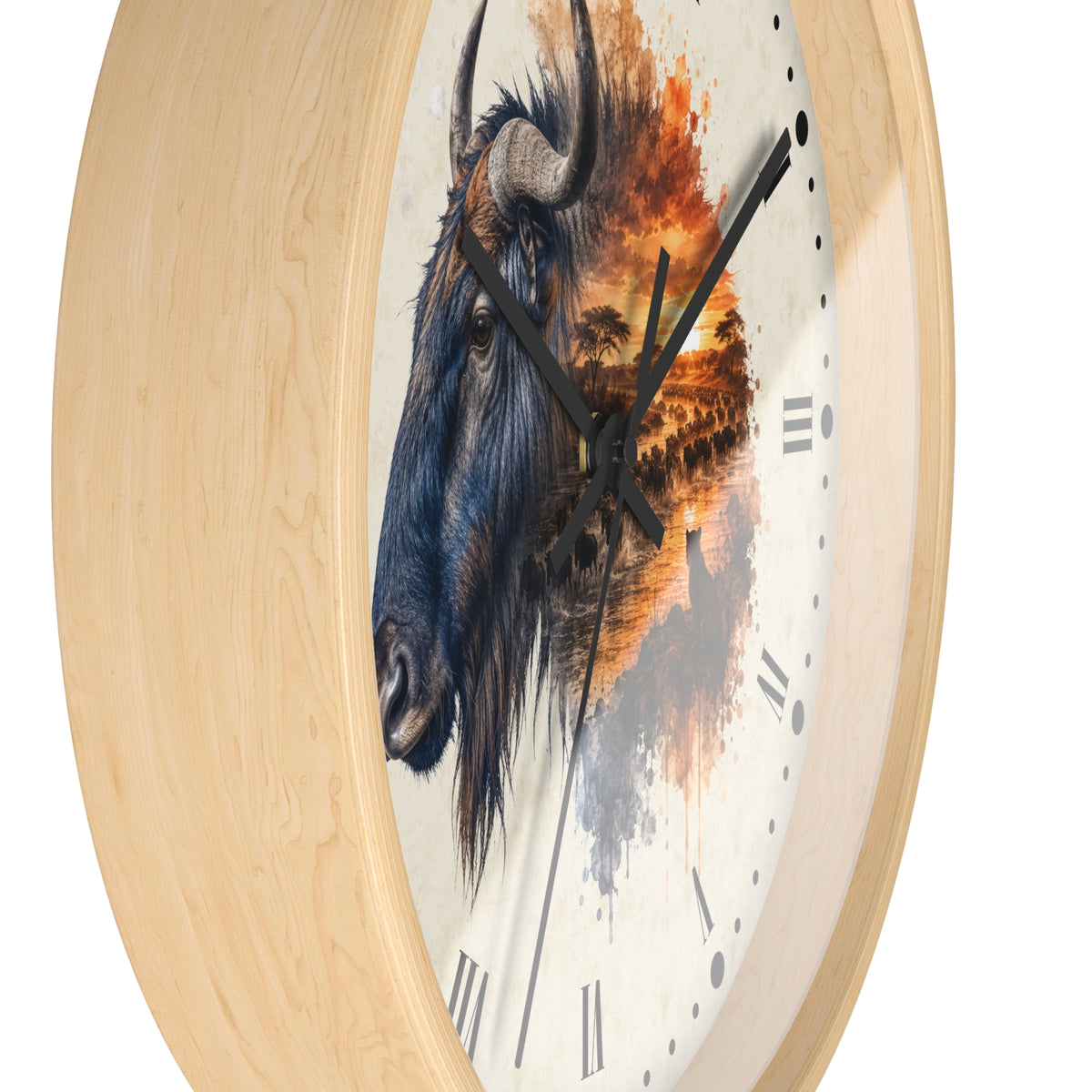 Round wall clock with a light natural wood frame and a printed face featuring a detailed blue-gray Wildebeest portrait blending into an orange sunset landscape. Black clock hands and Roman numerals are visible against a plain white background.