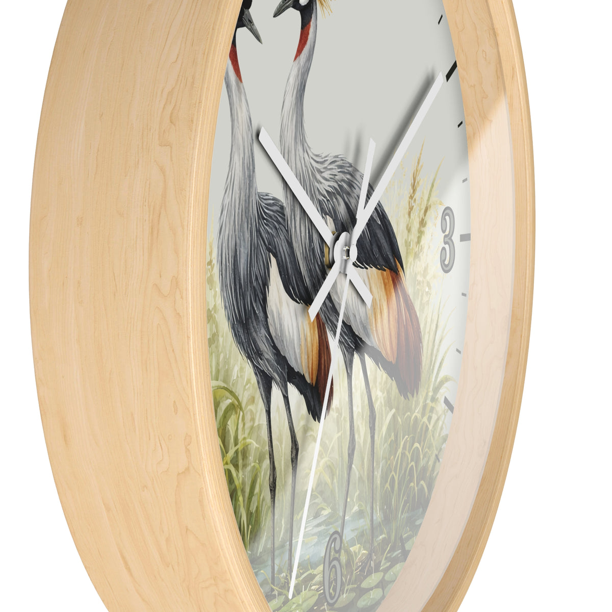 Round wall clock with a light natural wood frame and a printed bird illustration on the face, shown against a plain white background.