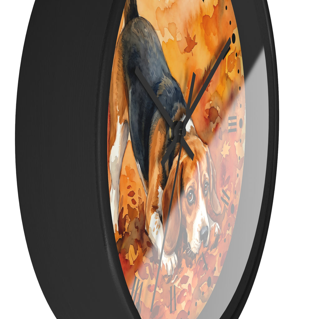 A round wall clock with a black frame and a printed autumn-themed face showing a beagle dog among orange and brown leaves, photographed against a white background.