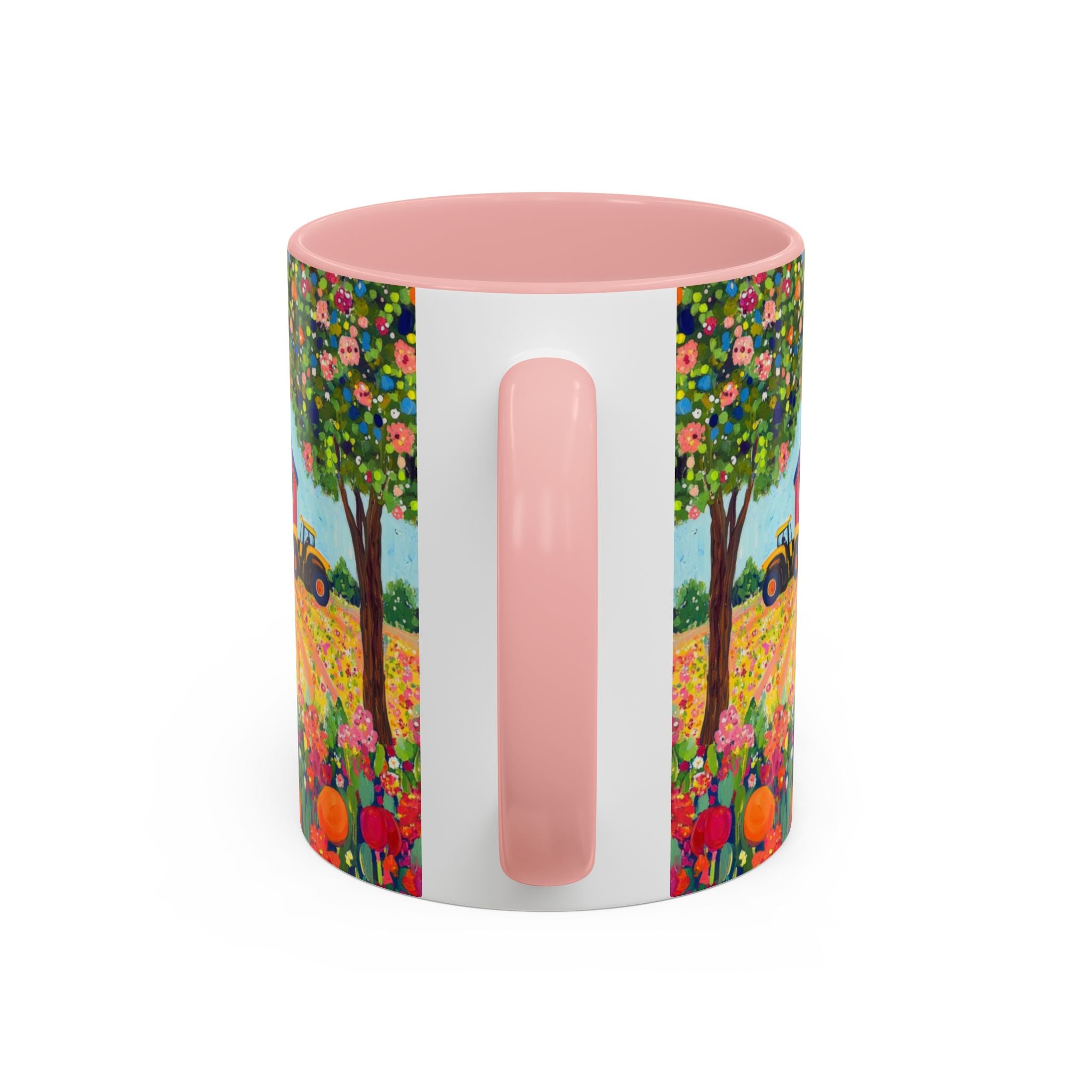 Colorful mug with floral design and pink handle on a white background