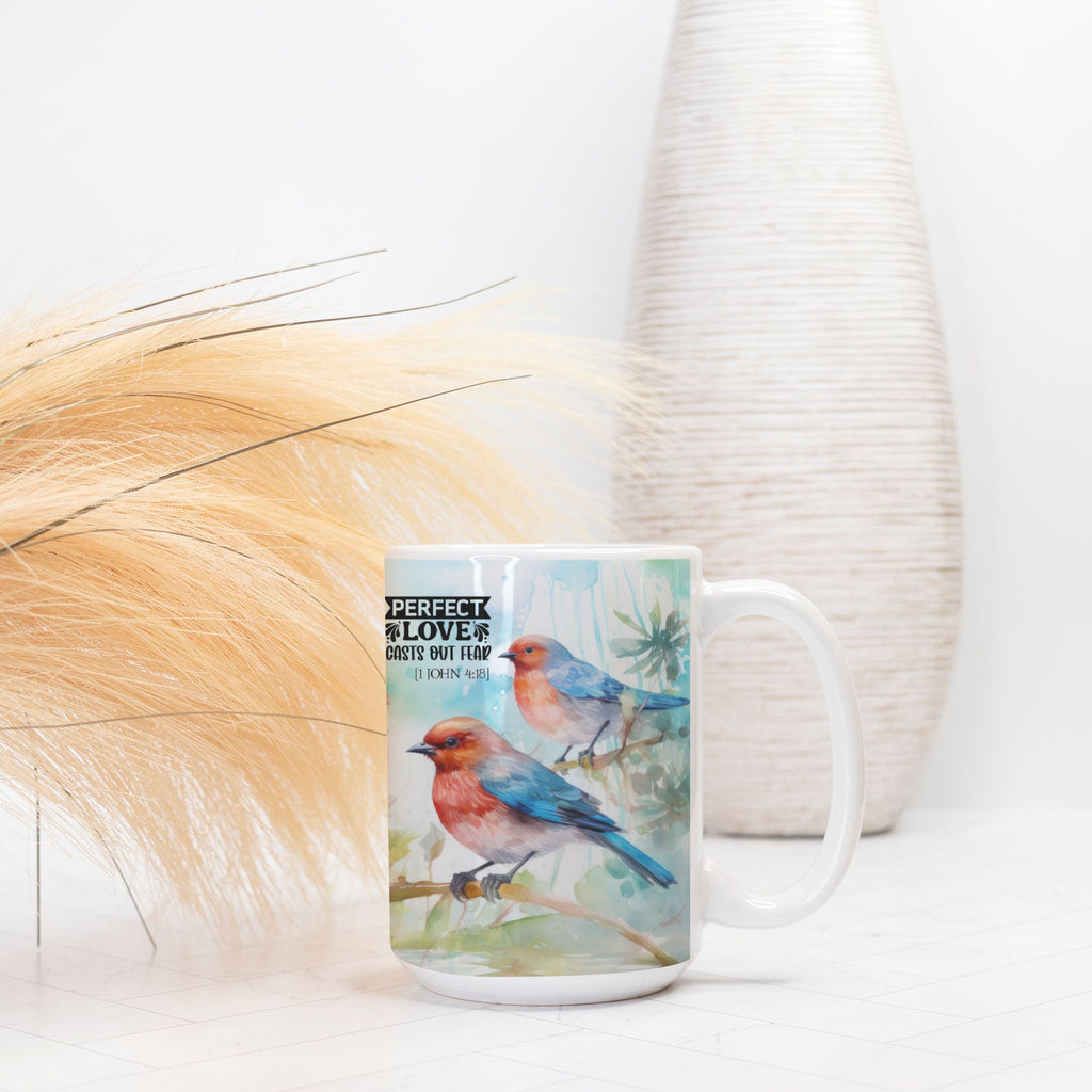 Mug with bird design and text on a white surface with decorative elements