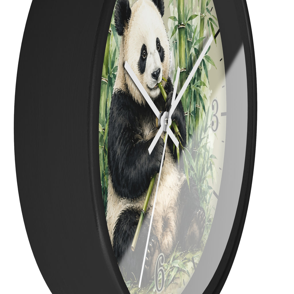 A round wall clock with a black frame and a printed panda-on-bamboo face, shown against a plain white background.