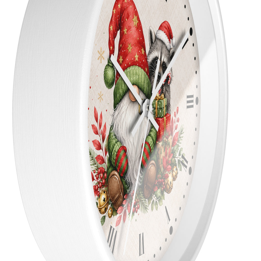 A round white wall clock with a festive Christmas illustration on the face, featuring a raccoon dressed as Santa, a gnome, red ornaments, green foliage, and Roman numeral hour markers.