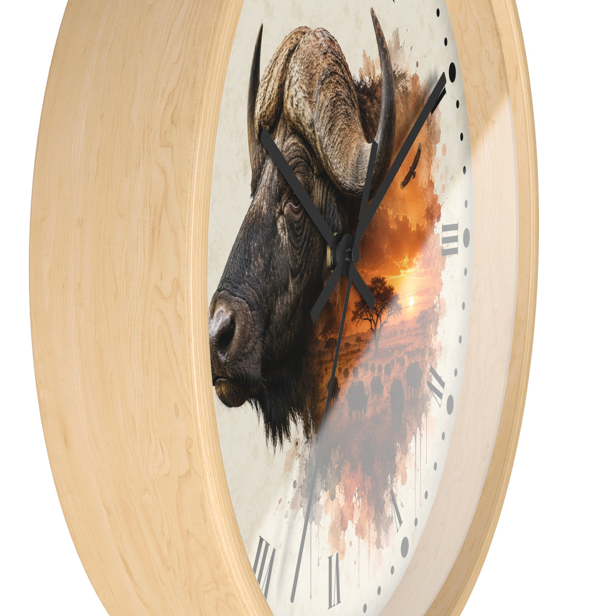 Round wall clock with a light natural wood frame and a printed face featuring a bison head over an orange sunset scene, with black Roman numerals and black hands.