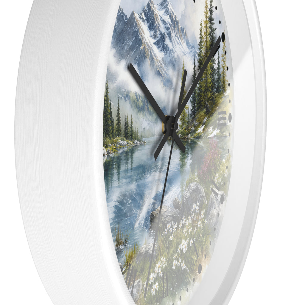 A white oval wall clock with a scenic mountain lake landscape printed on the face, shown against a plain white background.
