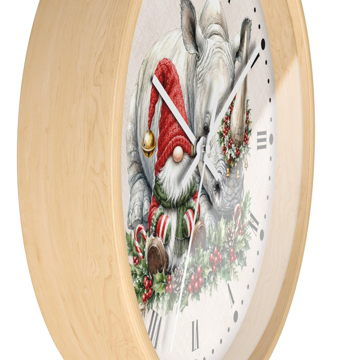 A round wall clock with a light natural wood frame and a white clock face featuring a whimsical illustration of a white rhinoceros wearing a red Santa hat and red-and-white striped socks, surrounded by holiday greenery and candy canes.
