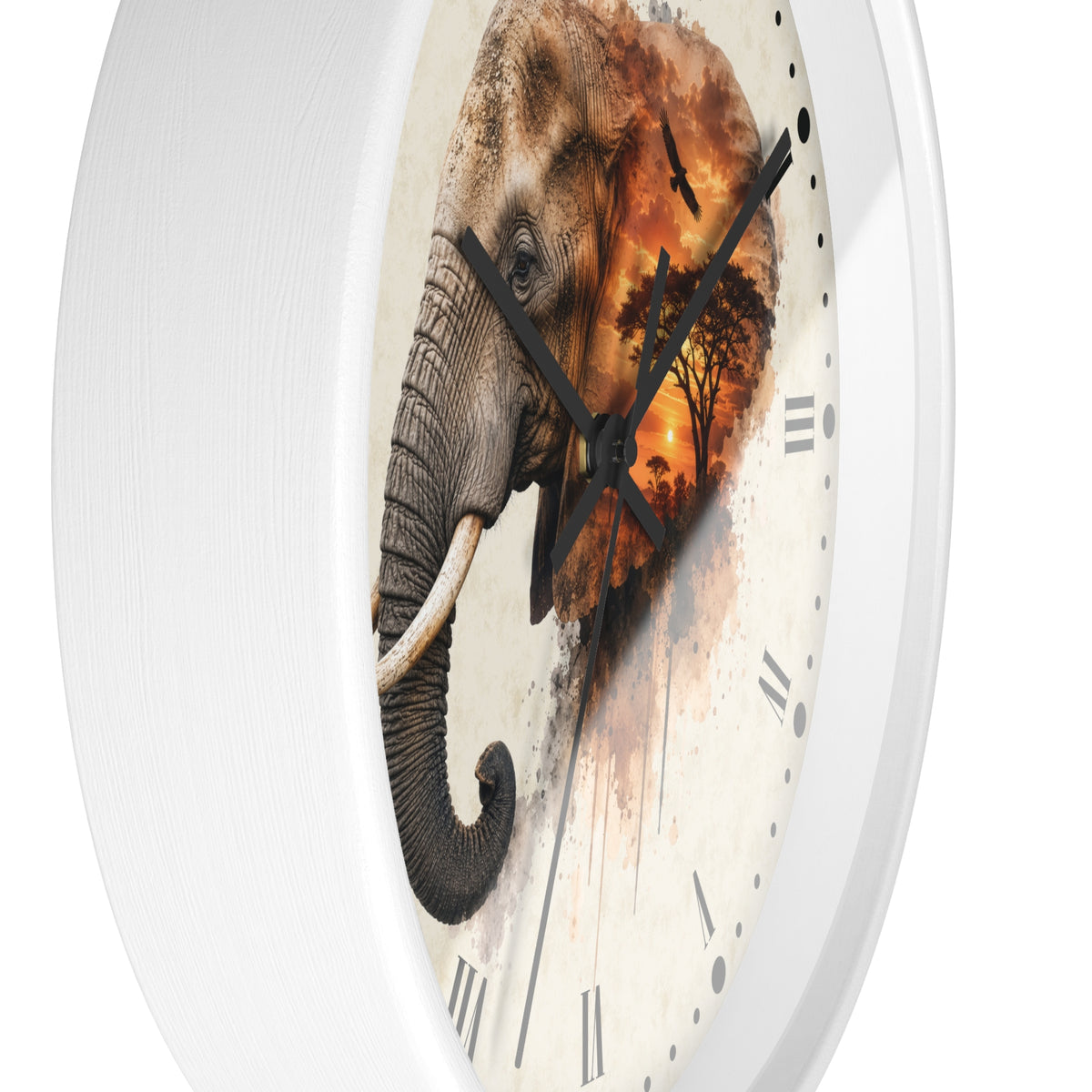 A round wall clock with a white outer frame and a printed face featuring a large elephant over an orange sunset landscape, with black Roman numerals and black hands.