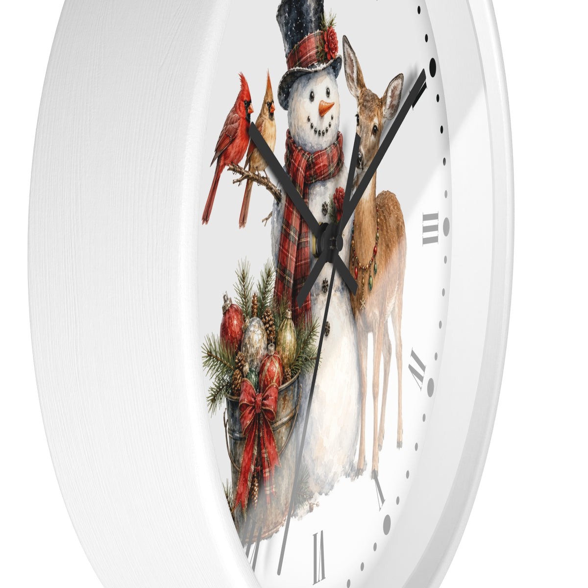 A white round wall clock with a festive Christmas illustration on the face, featuring a snowman in a plaid scarf and top hat, two red cardinals, a deer, and a small evergreen basket with ornaments.