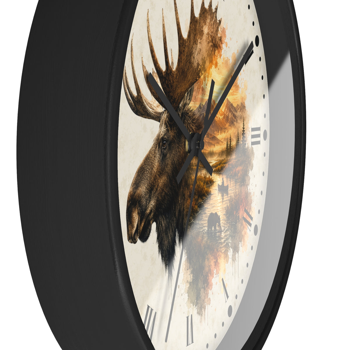 A round wall clock with a black frame and a cream-colored face featuring a detailed moose head illustration overlaid with warm-toned landscape artwork, shown against a plain white background.
