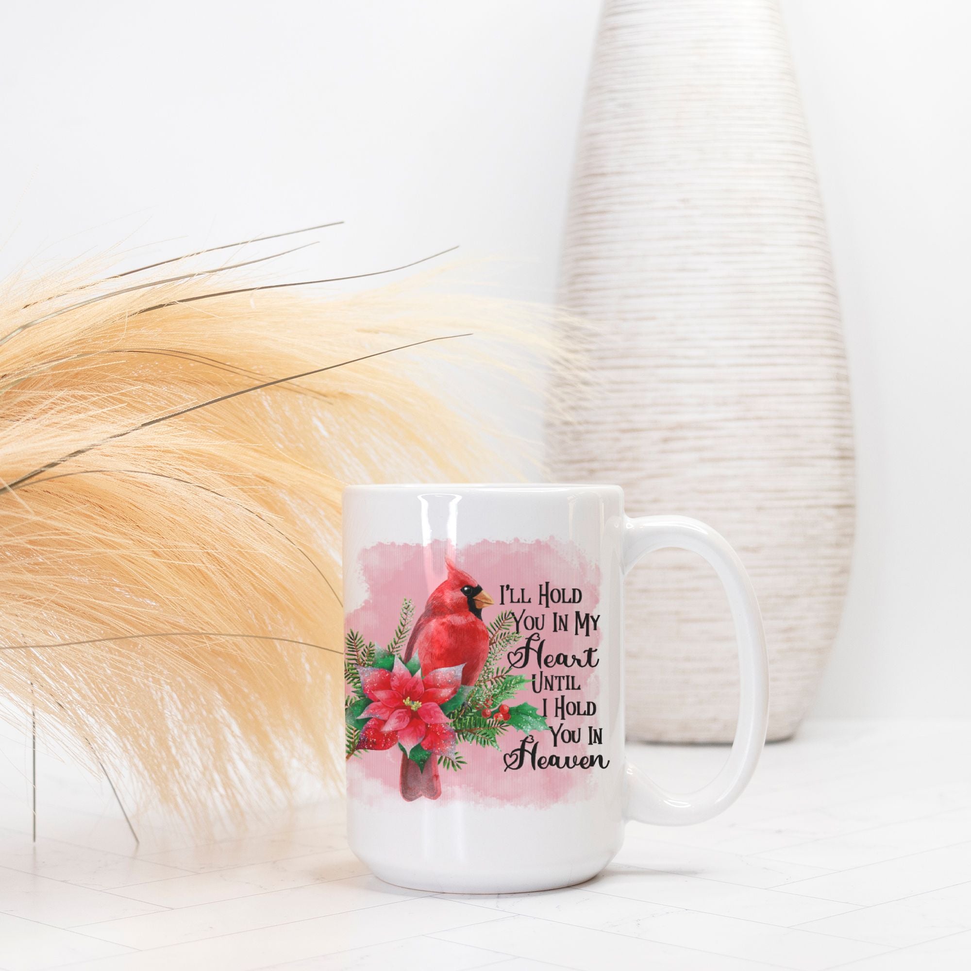 Mug with floral design and text on a white surface with decorative elements