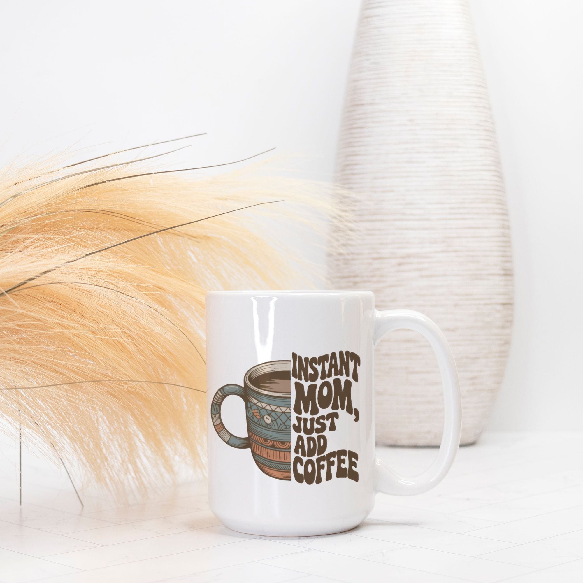White mug with 'Instant Mom, Just Add Coffee' text on a white background