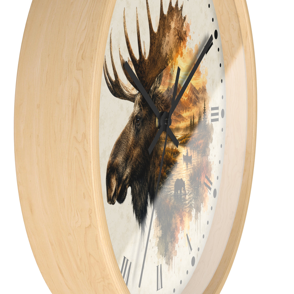 Round wall clock with a light natural wood frame and a printed face featuring a moose head over a warm-toned landscape scene with black clock hands and Roman numerals.