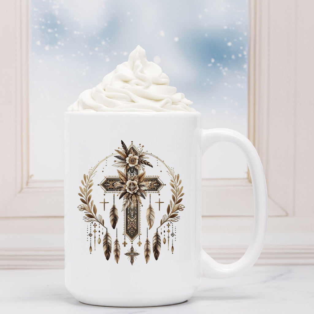 White mug with decorative cross and feather design, filled with hot chocolate and whipped cream.