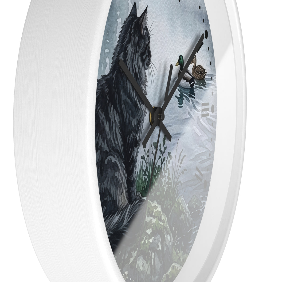 A white oval wall clock featuring a printed illustration of a black cat beside a snowy outdoor scene with a duck and small birds.