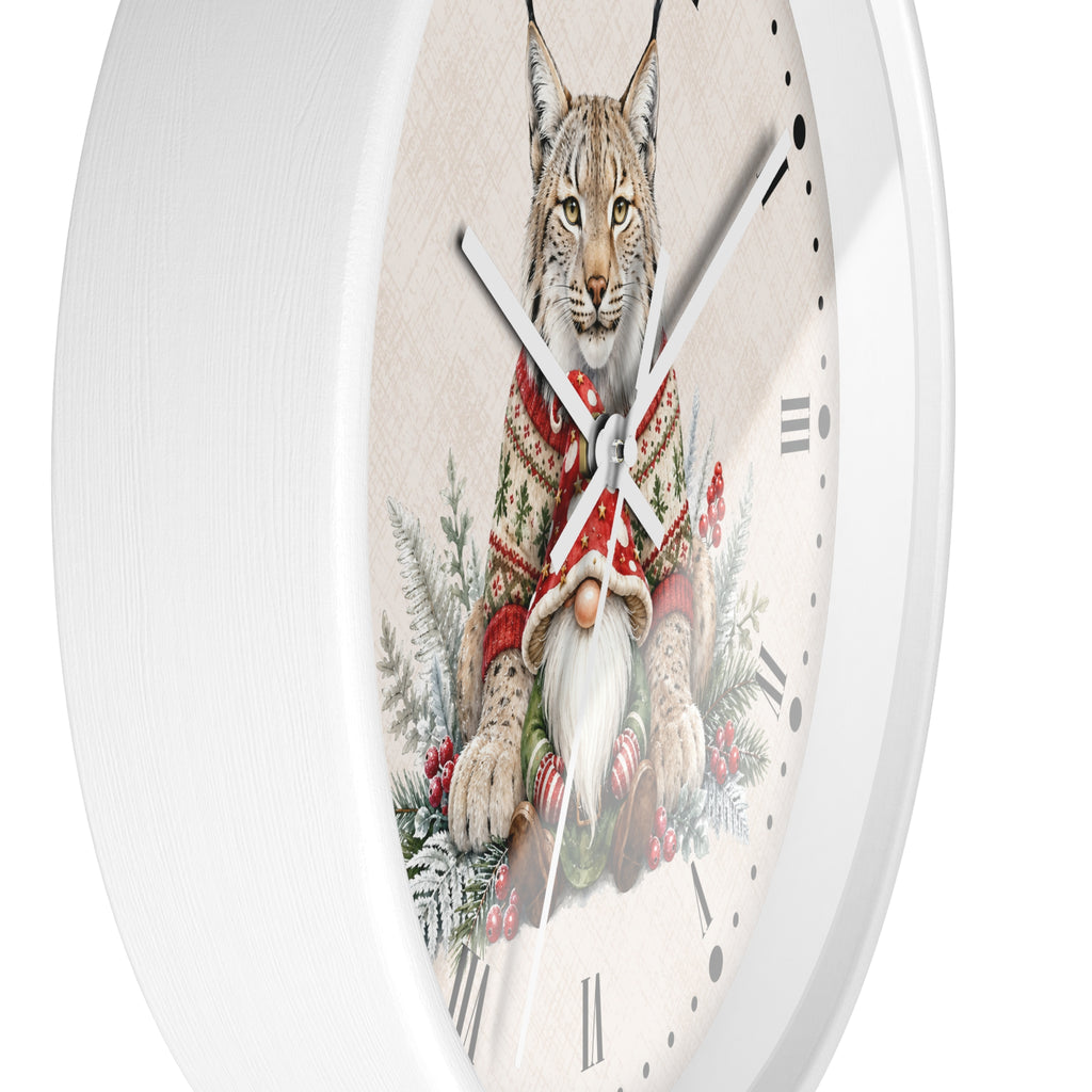 A round white wall clock with a detailed illustration of a lynx wearing a red knit sweater and a white beard, surrounded by winter greenery and candy canes on the clock face.